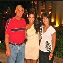 Katelyn Runck with her parents.
