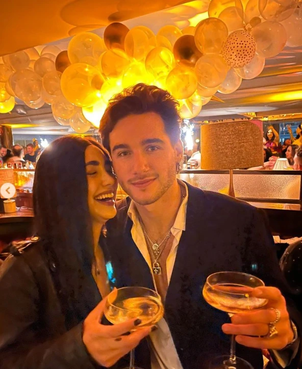 Alexa-Mansour-with-Jack-Diblasio-in-bar-enjoying-their-champagne
